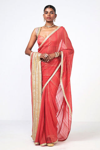 Rishi and Vibhuti Red Chandini designer saree crafted in georgette and Chanderi silk with elegant linear trim embroidery, paired with a matching blouse and petticoat, perfect for weddings, festive celebrations, receptions, and traditional occasions.
