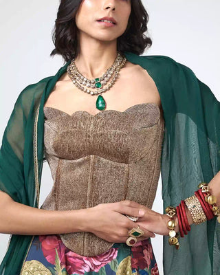 Close-up of scattered sequin embellishments and delicate hand embroidery on the corset bodice.
