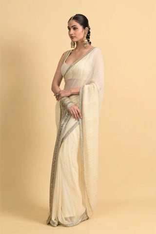Designer ivory saree, Georgette & Chanderi Silk fabric, Linear trim golden embroidery on the border of the saree. Perfect for wedding and festive or special occasions.