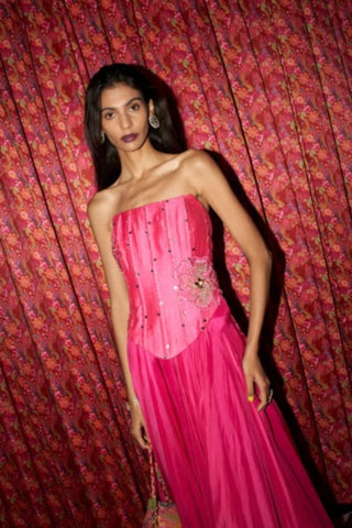 Fuchsia pink crepe corset lehenga set with handcrafted patchwork detailing and fit-and-flare silhouette by Rishi and Vibhuti.