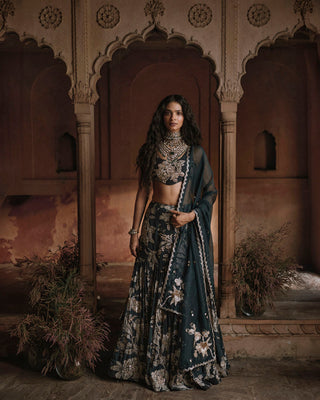 A close up look of the lehenga and an organza dupatta with scallops and delicate buttis.