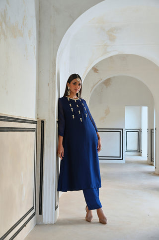 A royal blue floral butti kurta set with pant . A perfect women's ethnic wear for religious ceremony, festivities, parties or wedding events.