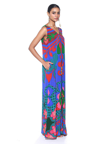 Model wearing an Electric Blue Royal Paisley Inverted Box Pleat Wide-Leg Jumpsuit by designer Siddharth Bansal, featuring vibrant ethnic prints, structured pleats, and flowing wide-leg pants - blending tradition with contemporary fashion.