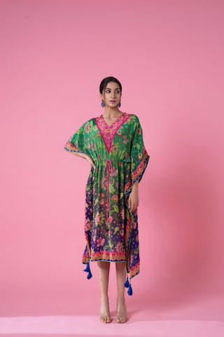 Tea Green And Yale Blue Ombre Floral Printed kaftan featuring delicate pom-pom lace along the edges, V-shaped neckline, and a cinched waist with a pink tasseled rope belt. Perfect for resort wear, casual day out, seaside evenings. 