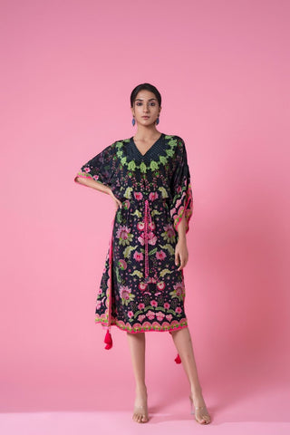 Midnight black ombre kaftan featuring a floral print, and delicate pom-pom lace along the edges, V-shaped neckline, and a cinched waist with a pink tasseled rope belt. Perfect for resort wear, casual day out, seaside evenings. Designed by Siddhartha Bansal.