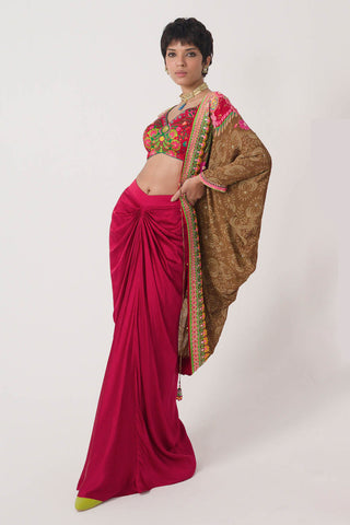 Earthy Brown And Red Border Hand Embroidered Shrug, Crimson Cranberry Red Printed Sleeveless Blouse, Velvet Dream Red Drape Skirt. Crepe and satin gypsy dress and bohemian women's fashion for cocktail parties, festive gatherings, or resort wear. Designed by Siddharth Bansal.