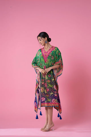 A breezy tea green and yale blue Ombre floral print kaftan perfect for resort wear, featuring lightweight fabric, soft embroidery, and pom-pom lace trimming. The free-flowing design adds comfort and elegance.