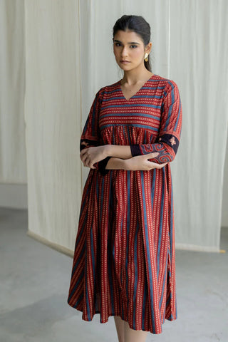 Veha red and indigo striped cotton V-neck flared midi dress. Flowy holiday dress featuring an eye-catching print, perfect for beachside dinners, summer trips and resort wear.