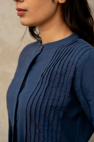 Close-up of the indigo cotton kurta by Vraj:bhoomi highlighting its pintuck detailing and deep blue colour.