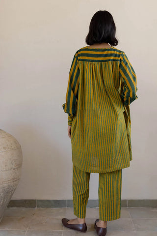 Back view of mustard and green stripe pintuck tunic and pant set with gathered back yoke